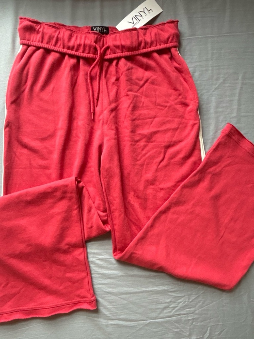 Salmon red sweatpants with side stripe